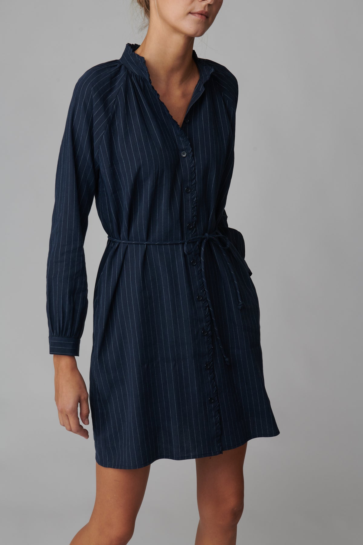 Emeline is 5'11 and wears a size S in navy pinstripe