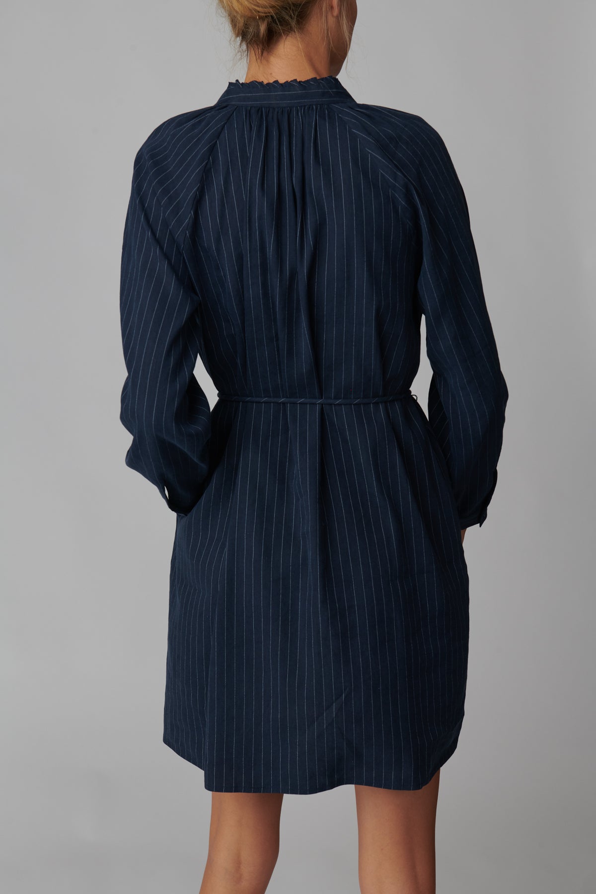 Emeline is 5'11 and wears a size S in navy pinstripe